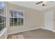 Bedroom featuring a window with a view, ceiling fan, and tile flooring at 2040 Royal Bay Blvd # 31, Kissimmee, FL 34746