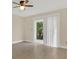 Bright bedroom featuring a sliding glass door to a patio area and tile flooring at 2040 Royal Bay Blvd # 31, Kissimmee, FL 34746