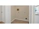 A simple laundry room with tile floors ready for a new washer and dryer at 2040 Royal Bay Blvd # 31, Kissimmee, FL 34746