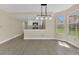Well-lit living area with a view of the kitchen, perfect for entertaining guests at 2040 Royal Bay Blvd # 31, Kissimmee, FL 34746