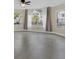 Bright living room featuring large windows, ceiling fan, and neutral colors at 2040 Royal Bay Blvd # 31, Kissimmee, FL 34746