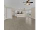 Open-concept living area with modern lighting and seamless access to the kitchen at 2040 Royal Bay Blvd # 31, Kissimmee, FL 34746