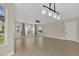 Spacious living room with large windows and modern ceiling fan at 2040 Royal Bay Blvd # 31, Kissimmee, FL 34746