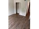 Comfortable bedroom with wood-look floors and a spacious closet at 2408 Swailes Dr # 6, Orlando, FL 32837