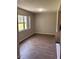 Inviting dining room features modern flooring and natural light from a large window at 2408 Swailes Dr # 6, Orlando, FL 32837