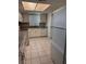 Bright kitchen featuring white cabinets, granite countertops, and white appliances at 2408 Swailes Dr # 6, Orlando, FL 32837