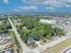 This aerial view offers a glimpse of this charming home nestled among lush greenery, near waterfront community amenities and ample parking at 2418 W 1St St, Sanford, FL 32771