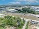 This aerial view captures the home's location near a highway and commercial areas, blending urban accessibility with private living at 2418 W 1St St, Sanford, FL 32771
