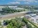 This aerial view captures the home's location near a highway and commercial areas, blending urban accessibility with private living at 2418 W 1St St, Sanford, FL 32771