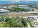 This aerial view captures the home's location near a highway and commercial areas, blending urban accessibility with private living at 2418 W 1St St, Sanford, FL 32771