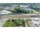 This aerial view captures the home's location near a highway and commercial areas, blending urban accessibility with private living at 2418 W 1St St, Sanford, FL 32771