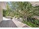 Large backyard features mature trees, shed, and landscaped areas, ideal for outdoor enjoyment at 2418 W 1St St, Sanford, FL 32771