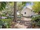 Private backyard with mature trees and diverse foliage at 2418 W 1St St, Sanford, FL 32771