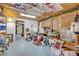 Unfinished basement with drop lighting, ceiling decor and painted concrete flooring at 2418 W 1St St, Sanford, FL 32771