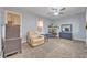 Cozy bedroom features a comfortable recliner, neutral tones, and a ceiling fan at 2418 W 1St St, Sanford, FL 32771