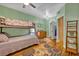 Cozy bedroom with a bunk bed, natural light and colorful decor at 2418 W 1St St, Sanford, FL 32771
