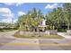 Charming two-story home with white picket fence and mature trees at 2418 W 1St St, Sanford, FL 32771