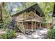 Unique raised stilt house with a large wooden deck at 2418 W 1St St, Sanford, FL 32771