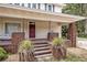 Inviting front porch with brick columns and steps at 2418 W 1St St, Sanford, FL 32771