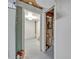 Hallway with access to unfinished rooms for customizable storage and utility solutions at 2418 W 1St St, Sanford, FL 32771