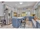 Stylish kitchen featuring a large island, stainless steel appliances, and two-tone cabinetry at 2418 W 1St St, Sanford, FL 32771