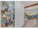 Bright kitchen with stainless steel appliances and an island and adjacent pantry for storage at 2418 W 1St St, Sanford, FL 32771