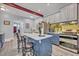 Well-appointed kitchen featuring a central island with seating and modern appliances at 2418 W 1St St, Sanford, FL 32771