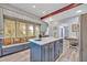 Bright kitchen features a central island with breakfast bar and a window seat at 2418 W 1St St, Sanford, FL 32771