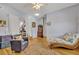 Bright living area features hardwood floors, a vintage-style chaise lounge, and a rug at 2418 W 1St St, Sanford, FL 32771