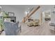 Comfortable living room with hardwood floors, fireplace, and staircase at 2418 W 1St St, Sanford, FL 32771