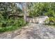 View of the gravel area with sheds and storage buildings at 2418 W 1St St, Sanford, FL 32771