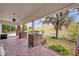 Spacious covered porch with brick detailing and view of the front yard at 2418 W 1St St, Sanford, FL 32771