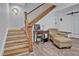 Elegant staircase with wooden banister leading to an office area at 2418 W 1St St, Sanford, FL 32771