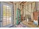 Unfinished utility room with spray foam insulation and an exterior door to the deck at 2418 W 1St St, Sanford, FL 32771