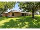 Expansive backyard with mature trees providing plenty of shade at 24720 Calusa Blvd, Eustis, FL 32736