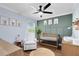 Well lit Bedroom with a rocker, modern crib, and animal themed artwork at 24720 Calusa Blvd, Eustis, FL 32736