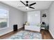 Bedroom with white pull down bed, and a play rug at 24720 Calusa Blvd, Eustis, FL 32736