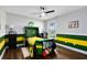 Themed room featuring a tractor bed, ceiling fan, wood-look flooring and playful decor at 24720 Calusa Blvd, Eustis, FL 32736