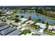 Neighborhood aerial view with stunning water and lush surroundings at 27143 Nostalgia Dr, Leesburg, FL 34748