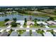 Stunning aerial view of home overlooking picturesque lake in a tranquil neighborhood at 27143 Nostalgia Dr, Leesburg, FL 34748