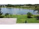 Enjoy serene lake views from this home's well-maintained backyard at 27143 Nostalgia Dr, Leesburg, FL 34748