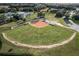 Aerial shot of a baseball field with well maintained grass, fencing, and dugouts in the community at 27143 Nostalgia Dr, Leesburg, FL 34748