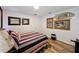 Comfortable bedroom featuring stylish decor, wood floors, and elegant wall art at 27143 Nostalgia Dr, Leesburg, FL 34748