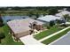 Charming single-story home with well-manicured lawn and beautiful landscaping at 27143 Nostalgia Dr, Leesburg, FL 34748