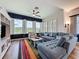 Inviting living room with lake views through plantation shutters, perfect for relaxation and entertainment at 27143 Nostalgia Dr, Leesburg, FL 34748