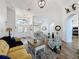 Bright and airy living room with open floorplan, features a double door entry and dining area at 27143 Nostalgia Dr, Leesburg, FL 34748