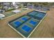 Aerial view of pickleball and bocce ball courts in a Legacy of Leesburg active adult community at 27143 Nostalgia Dr, Leesburg, FL 34748