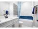 Bright bathroom featuring a shower and tub combination with white cabinets and chrome fixtures at 2739 Ravencliffe Ter, Oviedo, FL 32765