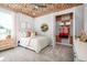 Bedroom with flowered ceiling, beige carpet, twin bed and an open closet with decorations at 2739 Ravencliffe Ter, Oviedo, FL 32765