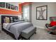 Bedroom with orange ductwork and a gray upholstered bed with throw pillows and engineered artwork at 2739 Ravencliffe Ter, Oviedo, FL 32765